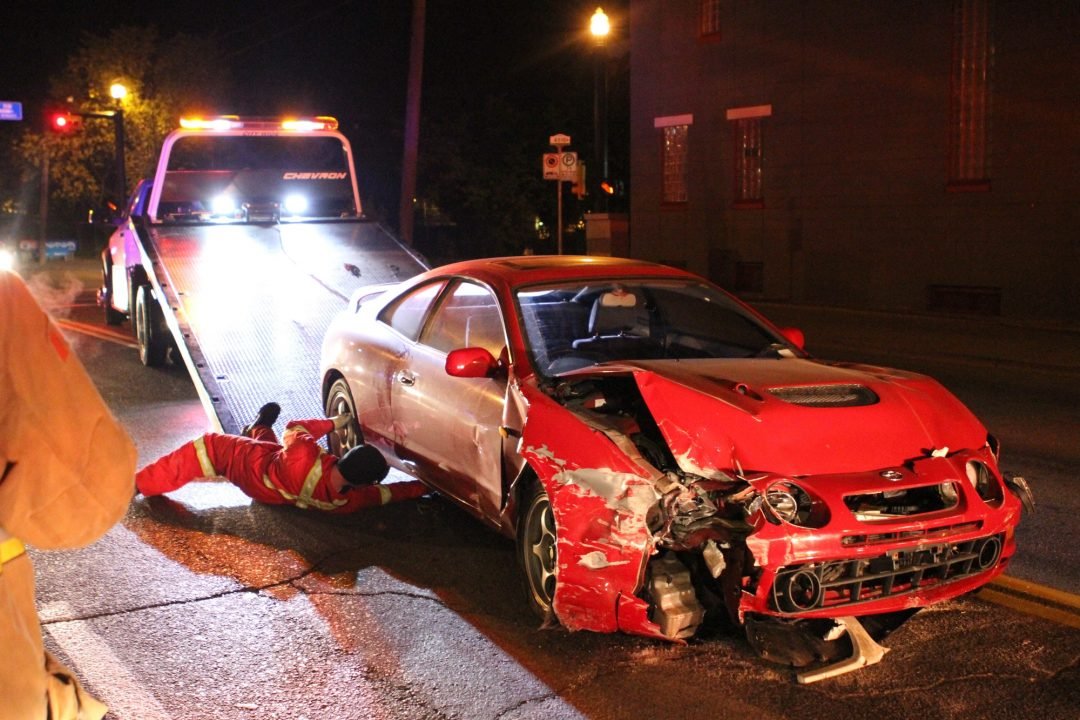 Crashed car being loaded onto a tow truck