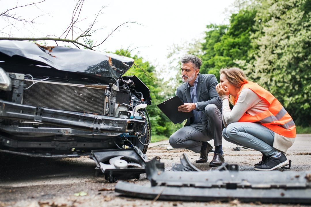 Driver getting roadside help beside her car