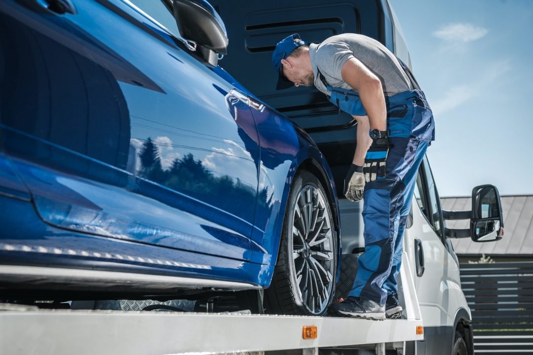 Tow truck operator securing a vehicle in Sydney