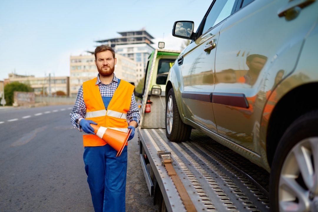 Roadside worker placing a safety cone